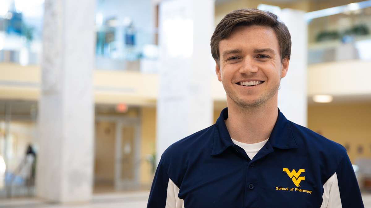 Matthew Brooks, pharmacy student, poses for a headshot.